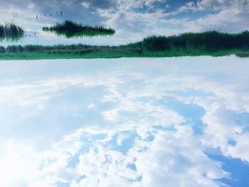 Scenic view of landscape against cloudy sky