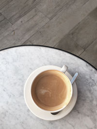 High angle view of coffee cup on table