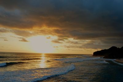 Scenic view of sea against sky during sunset