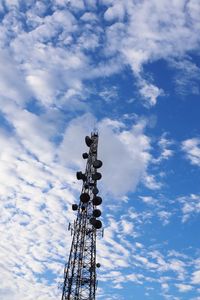 Low angle view of electricity pylon against sky