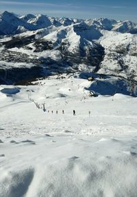 Aerial view of people on snow covered landscape