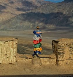 Buddhist prayer flag on roof of a monastery 