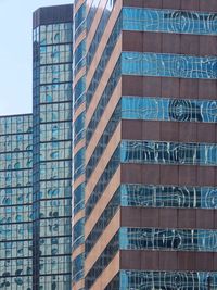 Low angle view of modern buildings against sky