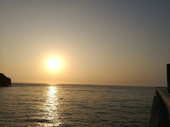 Scenic view of sea against sky at sunset