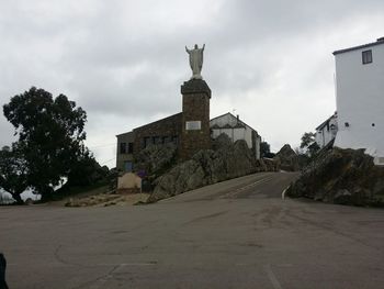Built structure against cloudy sky