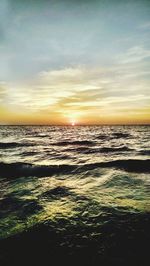 Scenic view of sea at sunset