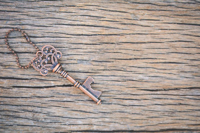 Directly above shot of key on wooden table