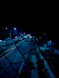 High angle view of illuminated street lights at night