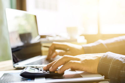 Man using laptop on table