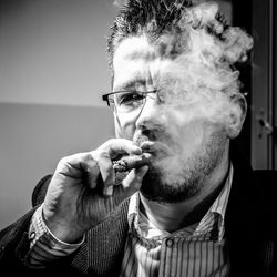 Portrait of man smoking cigarette