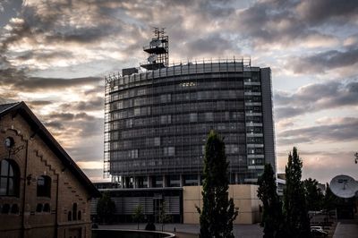 Low angle view of building against cloudy sky