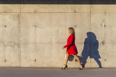 Fashionable woman walking in city