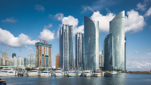 Panoramic view of modern buildings in city against sky