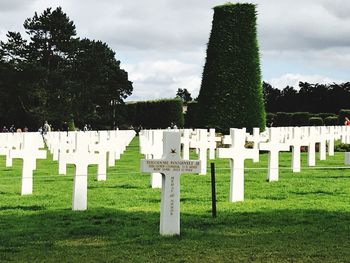 Row of cemetery against sky