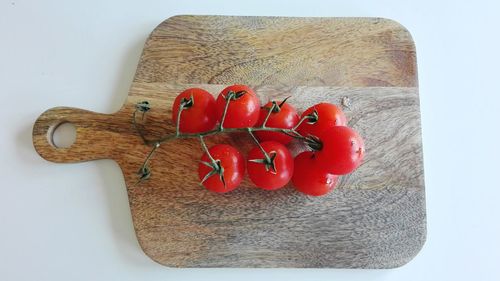 Close-up of red chili peppers on cutting board