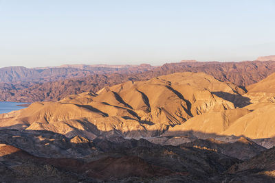 Arid desert mountains against the backdrop of the red sea. shlomo mountain, eilat israel