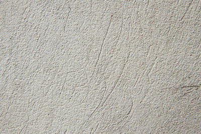 A concrete light-grey photo texture pattern. stone wall background. cement grunge pattern