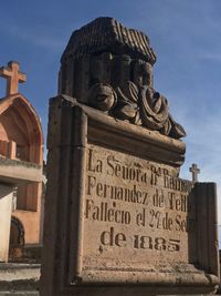 Low angle view of statue against sky