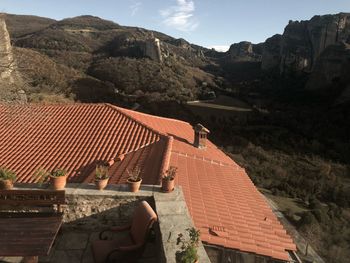 High angle view of houses on mountain against sky