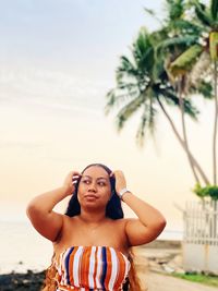 Portrait of woman sitting on beach