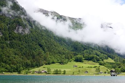 Scenic view of lake by mountains