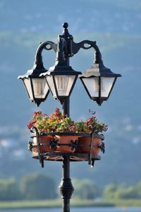 Close-up of street light against cloudy sky