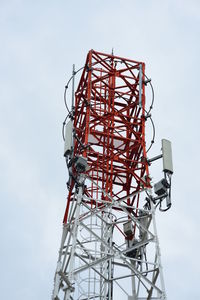 Low angle view of communications tower against sky