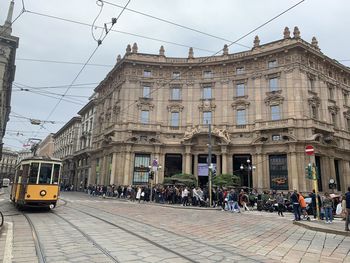 Cars on street amidst buildings in city