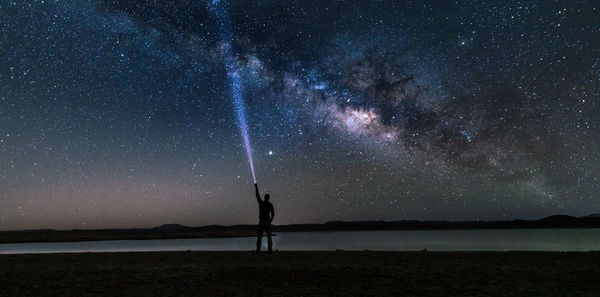 Scenic view of star field against sky at night