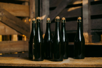 Close-up of wine bottles on table