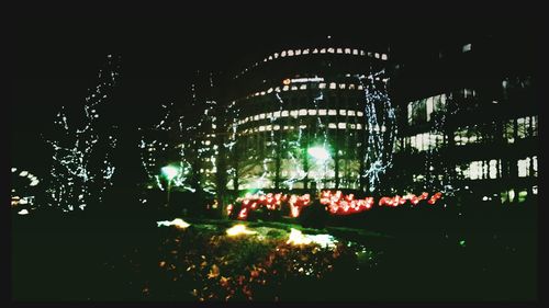 Low angle view of illuminated lights at night