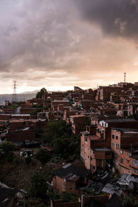 High angle shot of townscape against sky at sunset