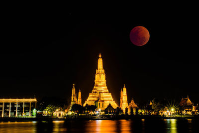 The lunar eclipse, super red full moon taken from top side of wat arun temple in bangkok thailand
