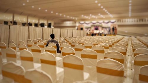 Empty chairs and tables in restaurant