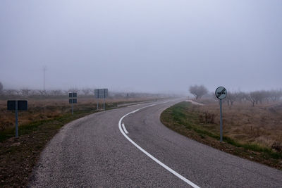 Empty road on a foggy morning