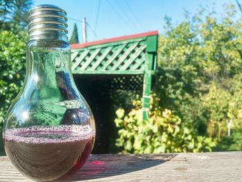 Close-up of glass bottle on table