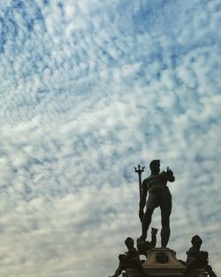 Low angle view of statue against sky