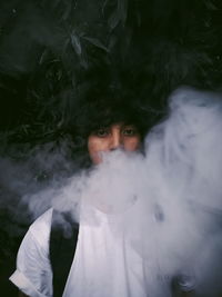 Portrait of young man smoking