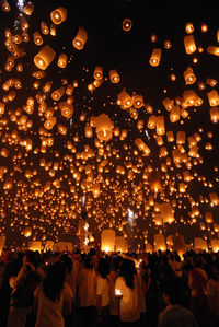 Low angle view of illuminated lanterns at night