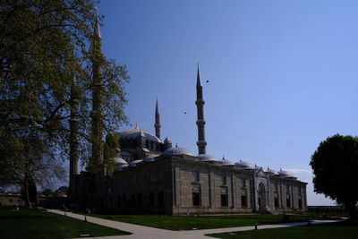 View of historical building against clear blue sky