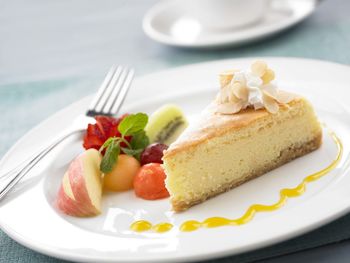 Close-up of cake and fruits on plate