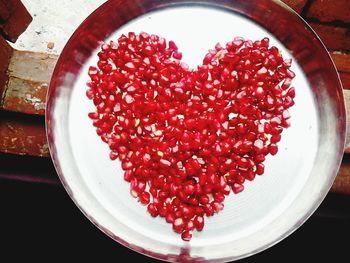 High angle view of red cherries in plate