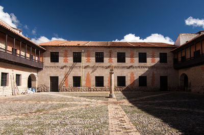 Buildings against blue sky and clouds