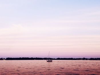 Scenic view of river at sunset