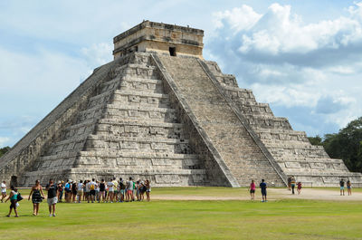 Group of people in front of historical building