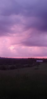 Scenic view of field against sky during sunset