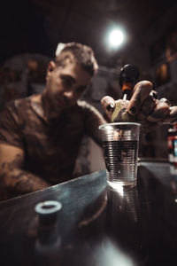 Male tattoo artist at workshop