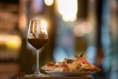 Close-up of wine in glass on table