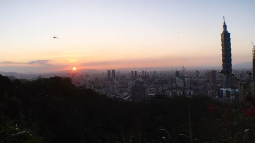 View of cityscape against sky during sunset