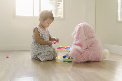 Cute boy playing with toy at home